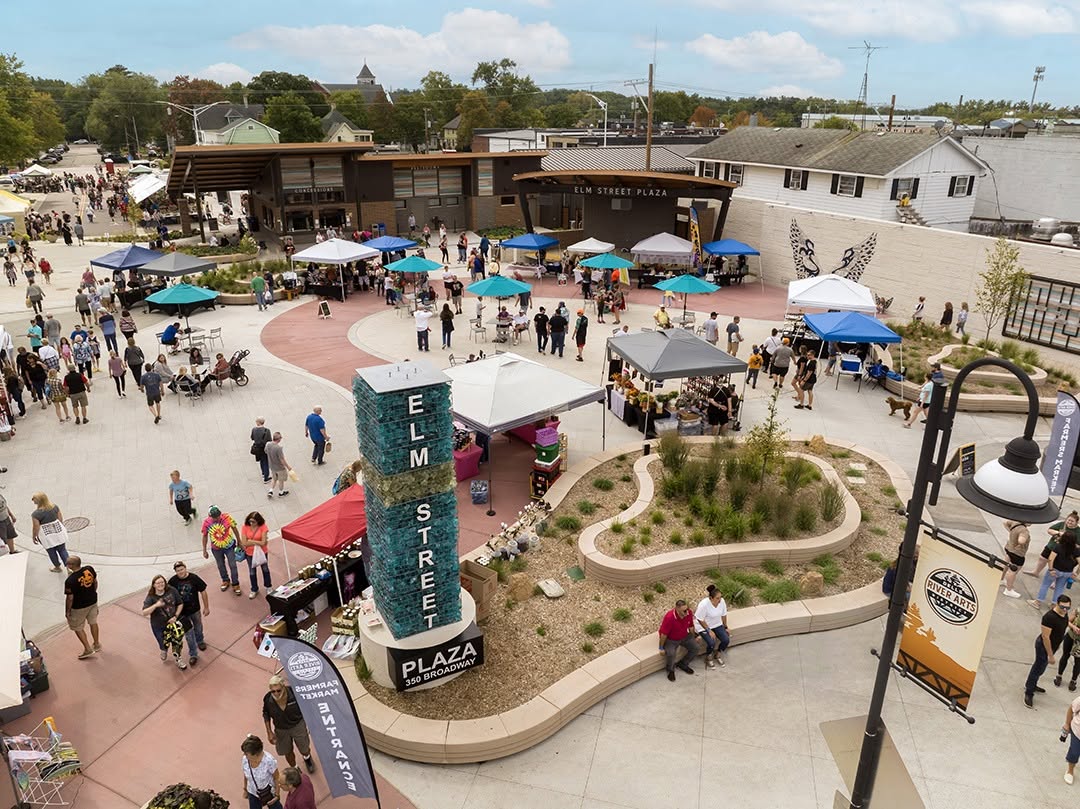 Aerial view of a busy market day at Elm Street Plaza