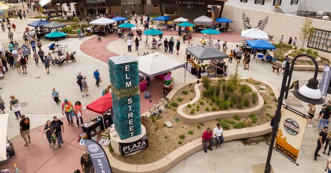 Aerial view of a busy market day at Elm Street Plaza
