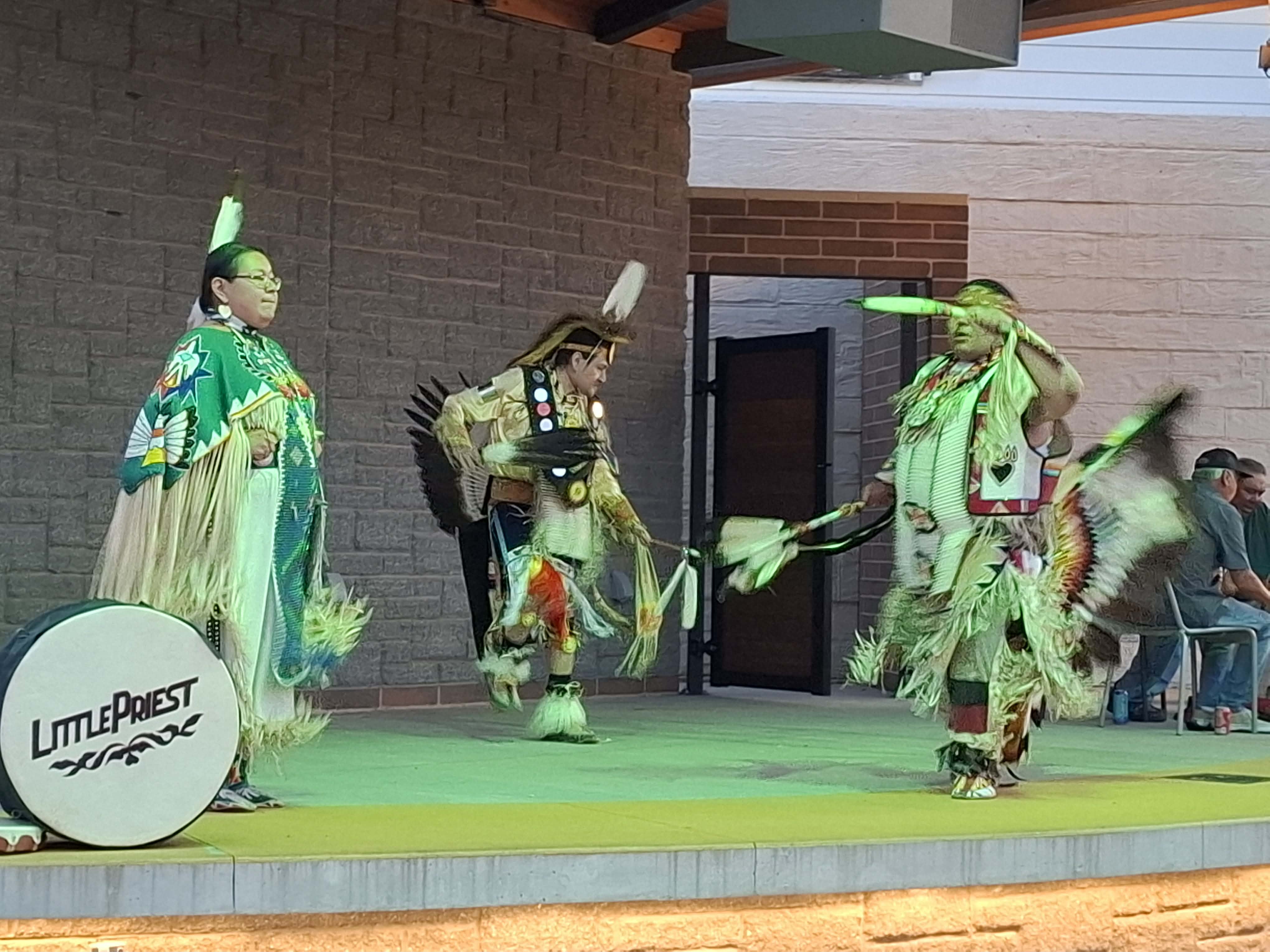 Little Priest Singers drum group performing at the plaza